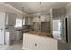 Modern kitchen with stylish white cabinets and an island, ready for your culinary adventures at 2925 Hughes Gasque Rd., Aynor, SC 29511