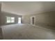 Bright living room with a view to the outside and an open doorway to another room at 2925 Hughes Gasque Rd., Aynor, SC 29511