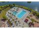 Community pool area featuring a large pool, splashpad, playground, lounge chairs, and palm trees at 296 West Palms Dr., Myrtle Beach, SC 29579