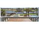 A scenic backyard with a swimming pool, spa, and golf course in the background at 296 West Palms Dr., Myrtle Beach, SC 29579