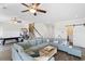 Spacious living room with a large sectional couch and multiple ceiling fans at 296 West Palms Dr., Myrtle Beach, SC 29579