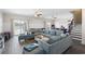 Spacious living room with a large sectional couch and access to the backyard at 296 West Palms Dr., Myrtle Beach, SC 29579