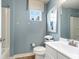 Well-lit bathroom showcasing framed mirror, modern white vanity and standard toilet at 300 Golan Circle # A, Myrtle Beach, SC 29579