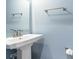 Powder room featuring a pedestal sink and light blue walls at 300 Golan Circle # A, Myrtle Beach, SC 29579