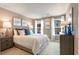 Cozy bedroom featuring a plush bed, bedside tables with lamps, and windows offering ample natural light at 300 Golan Circle # A, Myrtle Beach, SC 29579