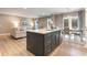 Contemporary kitchen boasts a stylish island with seating that opens into the living room at 300 Golan Circle # A, Myrtle Beach, SC 29579