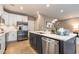 Well-lit kitchen featuring stainless steel appliances, sleek white cabinetry, and hardwood floors at 300 Golan Circle # A, Myrtle Beach, SC 29579
