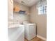 Functional laundry room with washer, dryer, and shelving for storage at 300 Golan Circle # A, Myrtle Beach, SC 29579