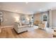 Cozy living room featuring hardwood floors, neutral tones, and ample natural light at 300 Golan Circle # A, Myrtle Beach, SC 29579