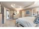 Primary bedroom featuring tray ceiling, dresser, and lots of light at 300 Golan Circle # A, Myrtle Beach, SC 29579