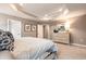 Primary bedroom featuring tray ceilings, dresser, and natural light at 300 Golan Circle # A, Myrtle Beach, SC 29579