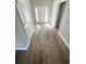 Bright entryway featuring wood floors and a white front door letting in natural light at 311 St. Andrews Ln., Myrtle Beach, SC 29588