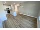 A kitchen with hardwood floors, white cabinets, stainless steel appliances, and granite counters at 311 St. Andrews Ln., Myrtle Beach, SC 29588