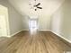 Spacious living room featuring wood floors, high ceilings, and a ceiling fan at 311 St. Andrews Ln., Myrtle Beach, SC 29588