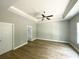 A main bedroom with tray ceiling, hardwood floors and bright windows at 311 St. Andrews Ln., Myrtle Beach, SC 29588