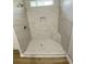 Modern tiled shower features include a built-in seat and niche, offering both style and convenience at 311 St. Andrews Ln., Myrtle Beach, SC 29588