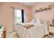 Bedroom with a white bed frame and decorated with pastel colors and decor at 321 Galway Ct., Longs, SC 29568