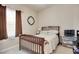 Simple bedroom with a wooden bed frame, soft lighting, and dark curtains at 321 Galway Ct., Longs, SC 29568