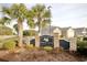 Arbor Glen entrance sign framed by palm trees and stone pillars welcomes you to a beautiful neighborhood at 321 Galway Ct., Longs, SC 29568