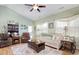 Comfortable living room with a ceiling fan, hardwood floors and comfortable furniture at 321 Galway Ct., Longs, SC 29568