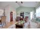 Open living room with vaulted ceilings, comfortable seating, and hardwood floors at 321 Galway Ct., Longs, SC 29568
