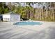 Community pool surrounded by tall trees and greenery provides a refreshing and serene escape at 321 Galway Ct., Longs, SC 29568