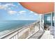 Spacious balcony with ocean views, white railing, and clear sliding door access at 3500 N Ocean Blvd. # 902, North Myrtle Beach, SC 29582