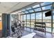 Modern gym features exercise equipment, free weights, and expansive windows with panoramic views at 3500 N Ocean Blvd. # 902, North Myrtle Beach, SC 29582