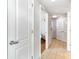 Bright hallway leads to multiple rooms with neutral walls, carpet, and tiled flooring at 3500 N Ocean Blvd. # 902, North Myrtle Beach, SC 29582