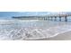 Scenic view of a wooden pier extending over the ocean waves, great for a leisurely stroll at 3500 N Ocean Blvd. # 902, North Myrtle Beach, SC 29582