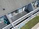 Aerial view showcasing private balconies of condo units with gray roofing and white railings at 3700 Golf Colony Lane # 13-H, Little River, SC 29566