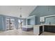 Spacious bedroom has light blue walls, natural light, and a ceiling fan at 3700 Golf Colony Lane # 13-H, Little River, SC 29566