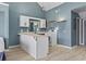 Open kitchen featuring an island, a sink, and white cabinets at 3700 Golf Colony Lane # 13-H, Little River, SC 29566