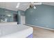 Sunlit main bedroom with a ceiling fan, adjacent kitchen, and a closet with ample storage at 3700 Golf Colony Lane # 13-H, Little River, SC 29566