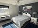 Bedroom features blue accent wall, area rug, and views of the water at 380-K Myrtle Greens Dr. # 380-K, Conway, SC 29526