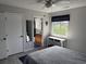 Bedroom featuring ensuite bathroom, light gray walls, and natural light at 380-K Myrtle Greens Dr. # 380-K, Conway, SC 29526