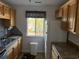 Functional kitchen with ample cabinet space, a window, and modern appliances at 380-K Myrtle Greens Dr. # 380-K, Conway, SC 29526