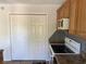 Bright kitchen with white appliances, tile backsplash, and wood cabinets at 380-K Myrtle Greens Dr. # 380-K, Conway, SC 29526