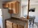 Kitchen with oak cabinets and view into dining area at 380-K Myrtle Greens Dr. # 380-K, Conway, SC 29526