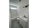 Bathroom with white sink, toilet and bathtub with shower head and features neutral colors and classic fixtures at 382 Waties Dr., Murrells Inlet, SC 29576