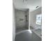 Modern bathroom showcases a beautifully tiled shower with niche, stylish fixtures, and new flooring at 382 Waties Dr., Murrells Inlet, SC 29576