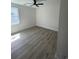 Bedroom features neutral paint, modern ceiling fan, beautiful flooring and a large window for natural light at 382 Waties Dr., Murrells Inlet, SC 29576
