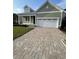 Charming one-story home with a two-car garage and brick paver driveway at 382 Waties Dr., Murrells Inlet, SC 29576