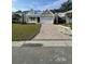 Charming one-story home with a two-car garage, manicured lawn, and brick paver driveway at 382 Waties Dr., Murrells Inlet, SC 29576