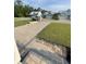 View of the homes along the street with paver driveways and manicured lawns at 382 Waties Dr., Murrells Inlet, SC 29576