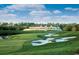 Scenic view of a golf course with a clubhouse overlooking the green at 382 Waties Dr., Murrells Inlet, SC 29576