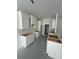 Kitchen area with white cabinets ready to be installed, under construction at 382 Waties Dr., Murrells Inlet, SC 29576