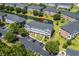 Aerial view of the condo complex showcasing well-maintained grounds, pond, and parking at 3927 Gladiola Ct. # 101, Myrtle Beach, SC 29588