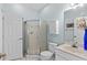A well-lit bathroom features a shower, toilet and vanity sink at 3927 Gladiola Ct. # 101, Myrtle Beach, SC 29588