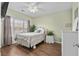 Cozy bedroom with large window, neutral colors, and ample natural light at 3927 Gladiola Ct. # 101, Myrtle Beach, SC 29588